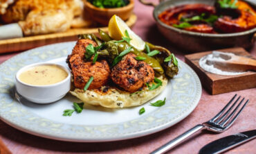 crilled chicken bread piece greens pepper sauce spices side view 1 1