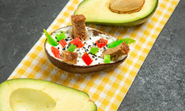 front view creamy avocados with fresh avocado dark grey space 1