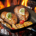 grilled chicken breast flaming grill with grilled vegetables tomatoes herbs lemon rosemary healthy lunch menu 1