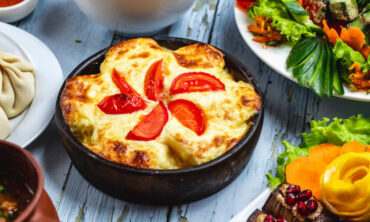 side view casserole with potato cheese tomato clay dish 141793 4802 1